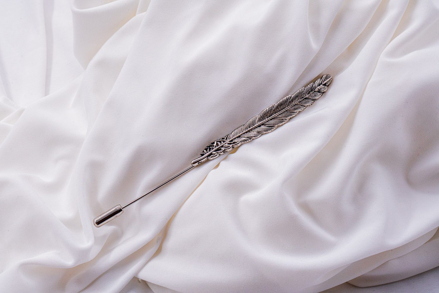 brooch with silver feather clothing pin three
