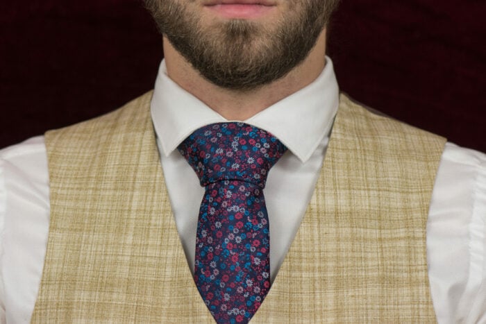 trendy men's tie with blue silk flowers on the neck